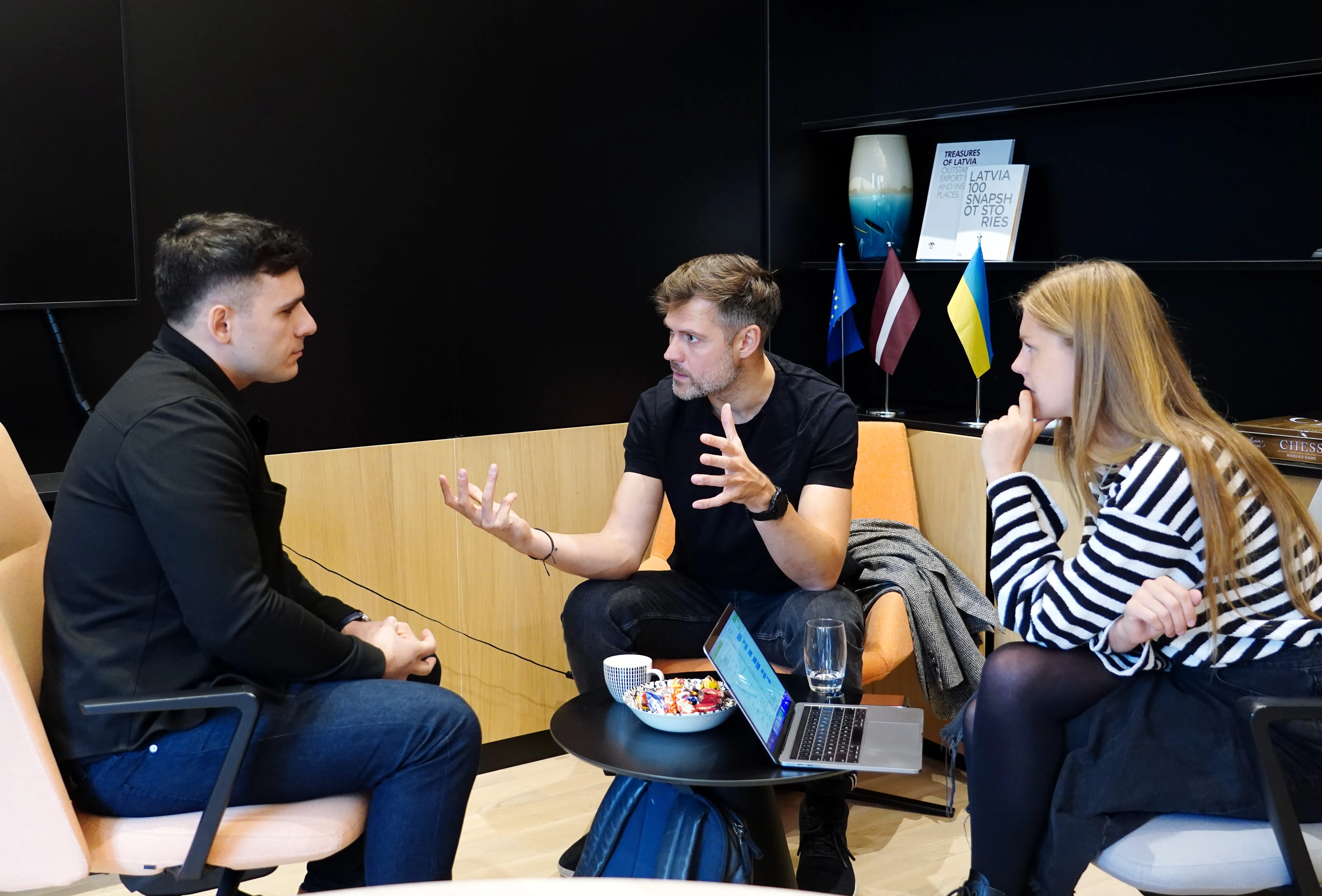 A group of three people having a discussion