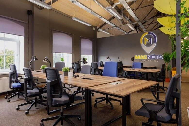 Desk with chairs at the Magnēts coworking space in Riga