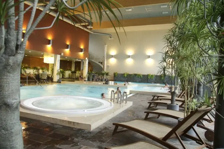 A swimming pool and a lounge area at Hotel Jūrmala SPA & Health Centre in Latvia
